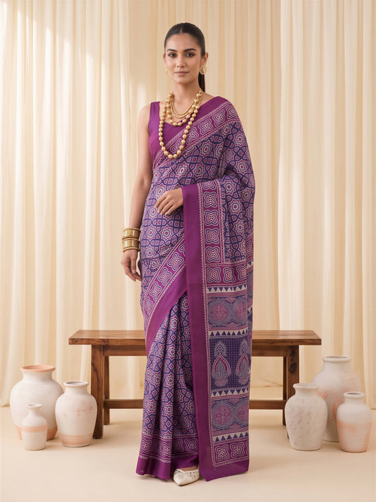 Woman wearing purple crepe saree with ajrak block-print motif work and purple blouse