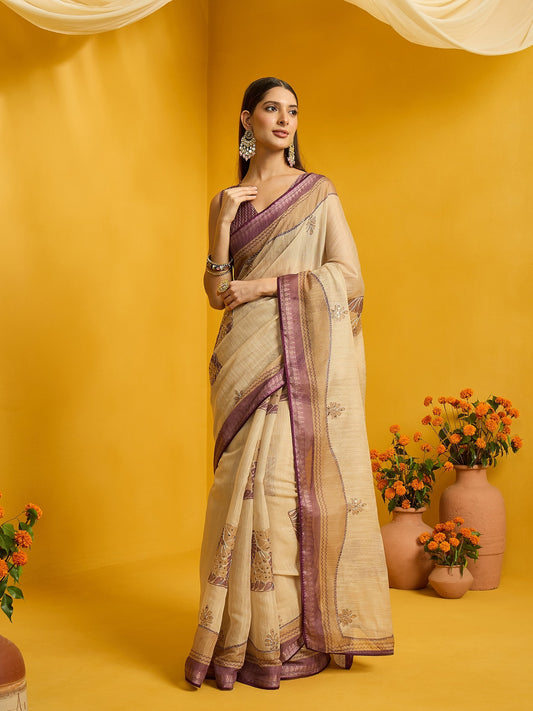 Woman wearing beige cotton blend saree with zari butta (metallic motif) work and purple blouse