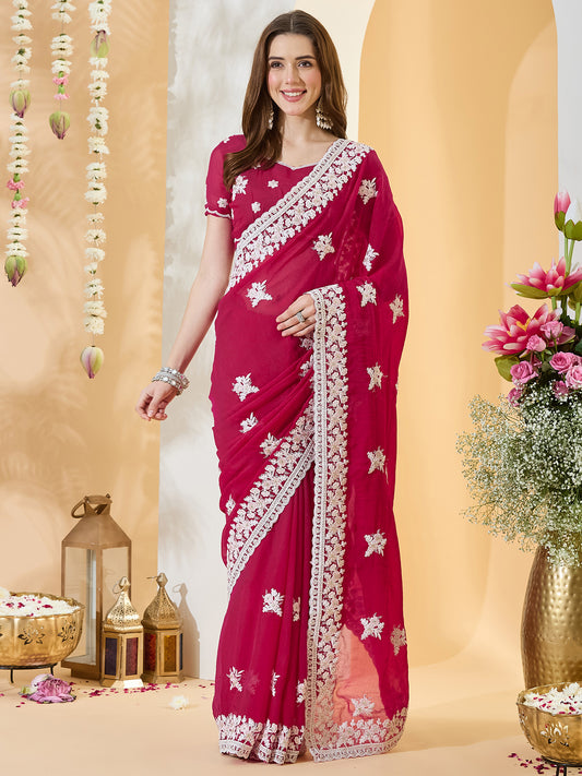 Woman wearing pink georgette saree with embroidered motif work and pink blouse