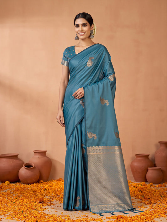 Woman wearing teal blue satin silk saree with animal-print design and teal blue blouse