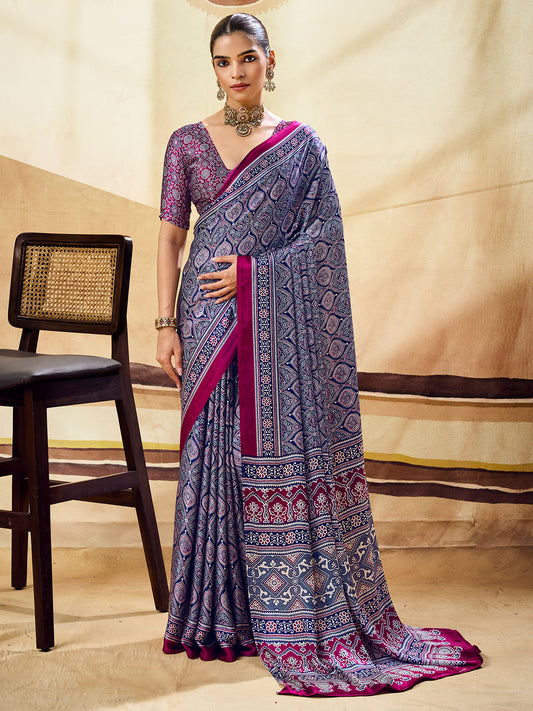 Woman wearing blue satin saree with ajrak block-print motif work and wine blouse