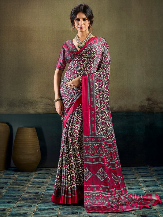Woman wearing burgundy satin saree with ajrak block-print motif work and burgundy blouse