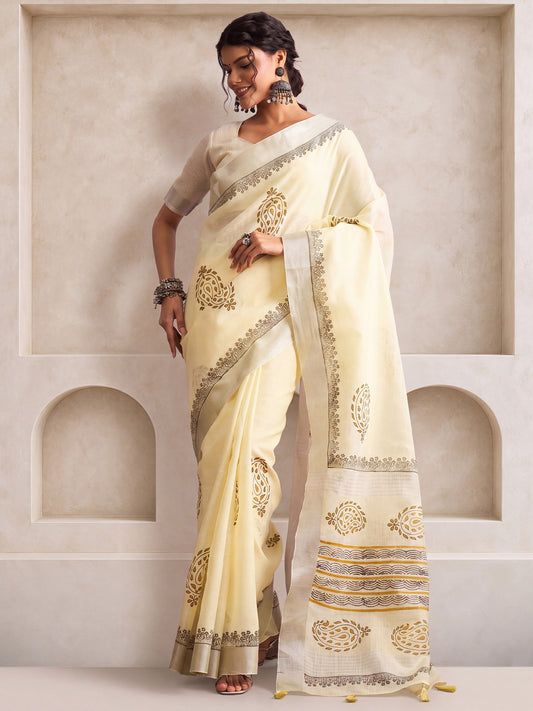 Woman wearing off white linen saree with bagh block-print motif work and off white blouse