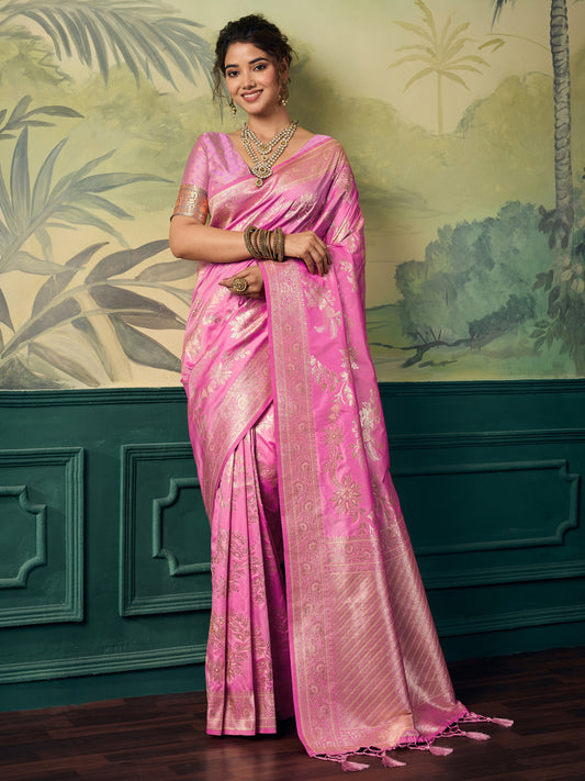 Woman wearing pink banarasi silk saree with woven motif design and pink blouse
