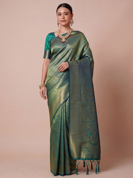 Woman wearing teal green silk blend saree with traditional indian motif work and teal green blouse