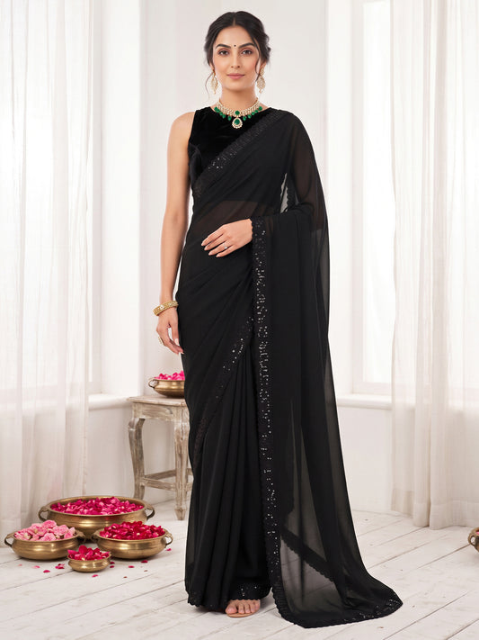 Woman wearing black georgette saree with clean solid-tone finish and black blouse