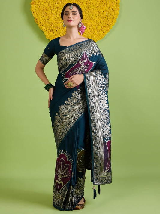 Woman wearing teal blue silk blend saree with woven motif design and teal blue blouse