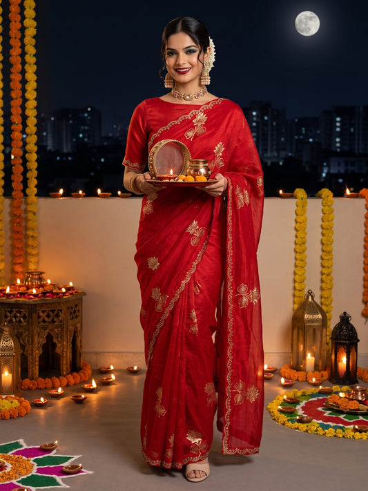 Woman wearing red georgette saree with metallic foil print work and pink blouse