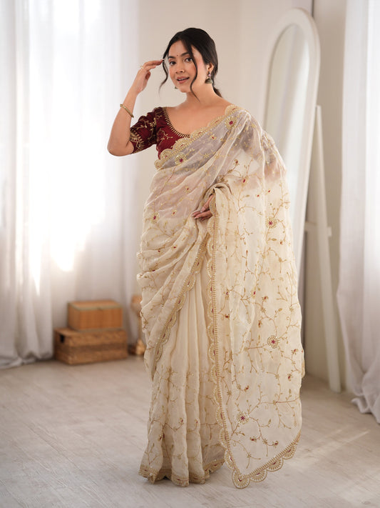 Cream embellished organza saree with maroon blouse piece