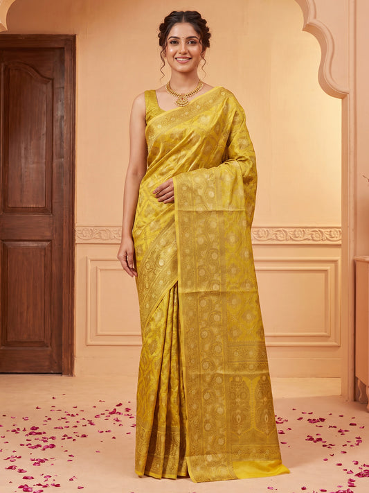 Woman wearing yellow silk blend saree with traditional indian motif work and yellow blouse