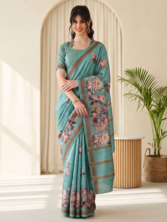 Woman wearing turquoise cotton blend saree with botanical floral and leaf design and turquoise blouse