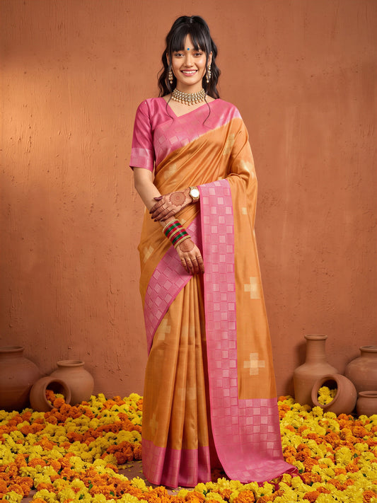 Woman wearing orange cotton blend saree with traditional indian motif work and pink blouse