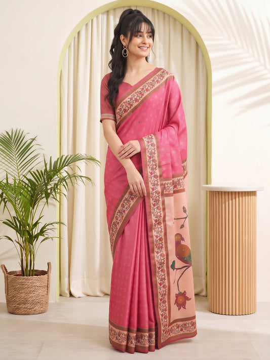 Woman wearing pink silk blend saree with traditional indian motif work and pink blouse