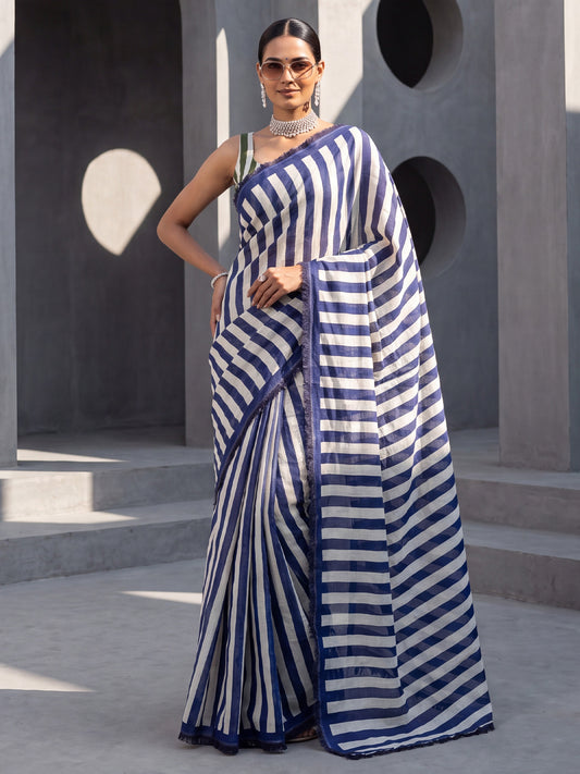 Woman wearing navy blue cotton saree with striped pattern design and green blouse