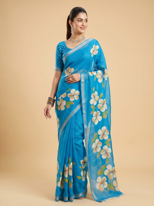 Woman wearing turquoise blue georgette saree with all-over floral design and turquoise blue blouse