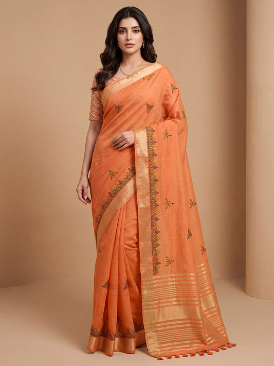 Woman wearing orange cotton linen saree with embroidered motif work and orange blouse