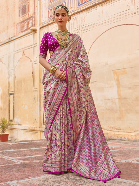 Woman wearing magenta silk blend saree with kalamkari narrative motif work and magenta blouse