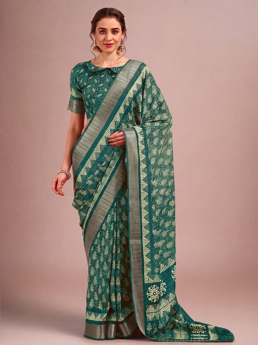 Woman wearing teal green cotton silk saree with traditional indian motif work and teal green blouse