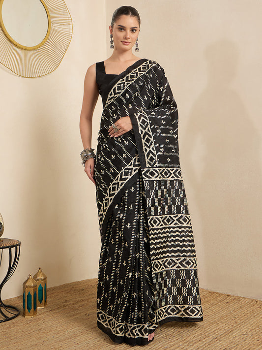 Woman wearing black bhagalpuri silk saree with batik wax-resist design and black blouse