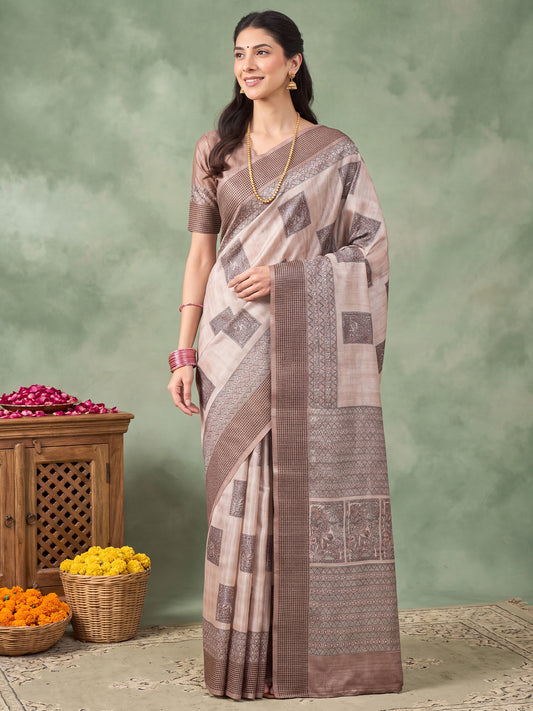 Woman wearing beige manipuri silk saree with madhubani folk-art motifs and beige blouse