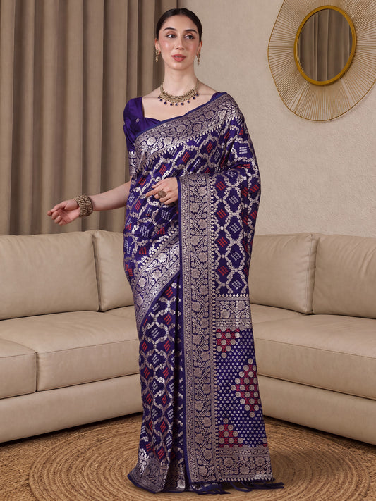 Woman wearing purple dola silk saree with bandhani tie-dye dot work and purple blouse