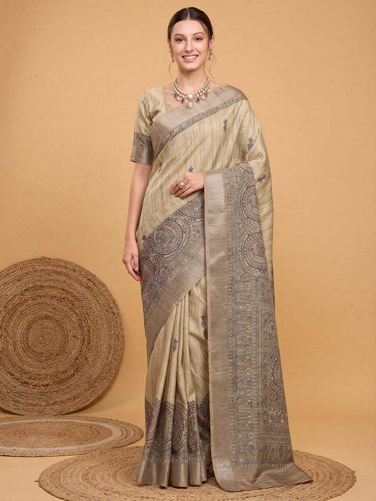 Woman wearing beige satin silk saree with kalamkari narrative motif work and beige blouse