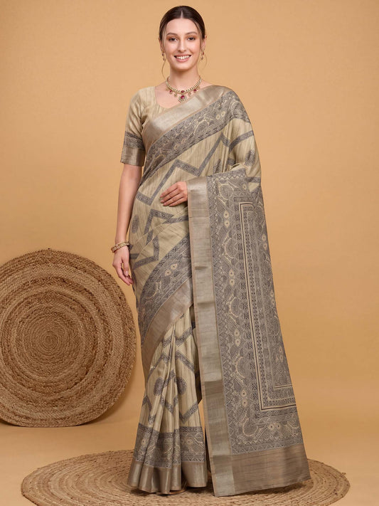 Woman wearing beige satin silk saree with kalamkari narrative motif work and beige blouse