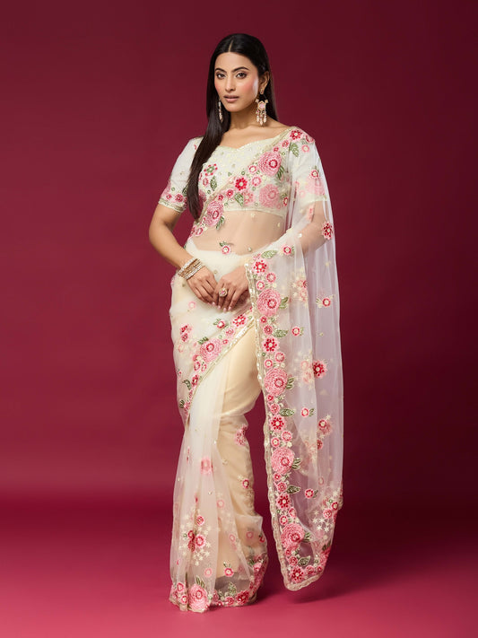 Woman wearing off white net saree with embroidered motif work and off white blouse