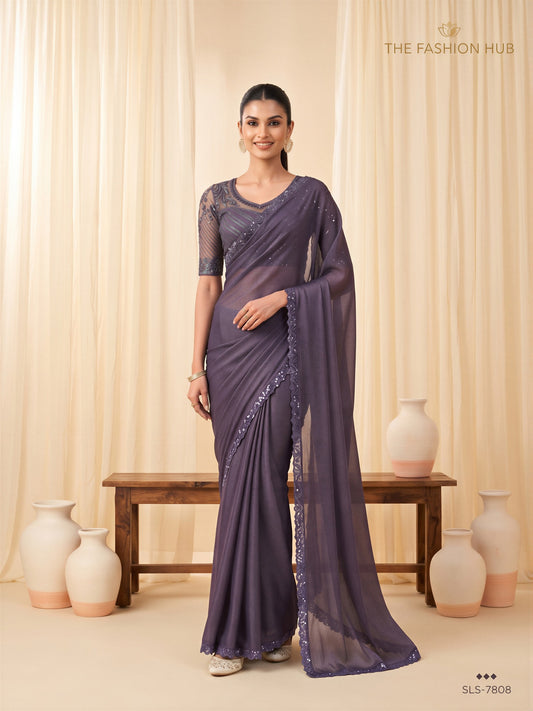 Woman wearing violet georgette saree with clean solid-tone finish and violet blouse