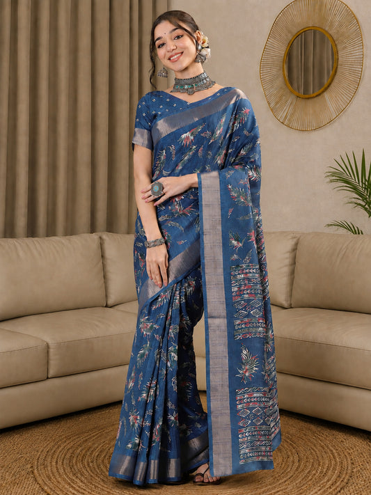 Woman wearing teal blue silk blend saree with botanical floral and leaf design and teal blue blouse