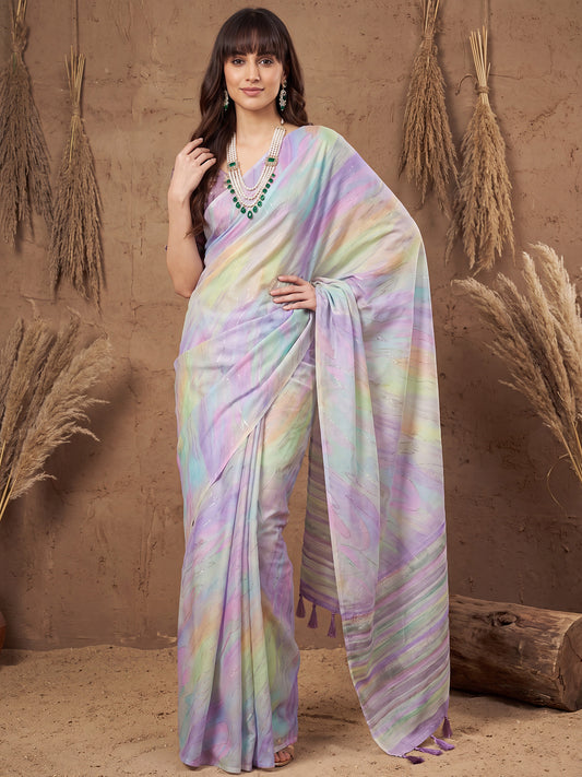 Woman wearing multicolored georgette saree with ombre graded colour work and lavender blouse
