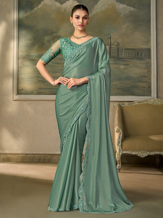 Woman wearing light blue chiffon saree with embroidered motif work and light blue blouse