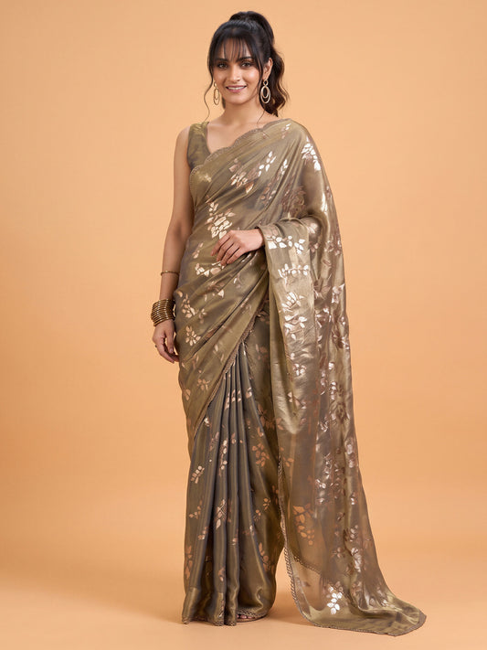 Woman wearing metallic satin silk saree with metallic foil print work and metallic blouse