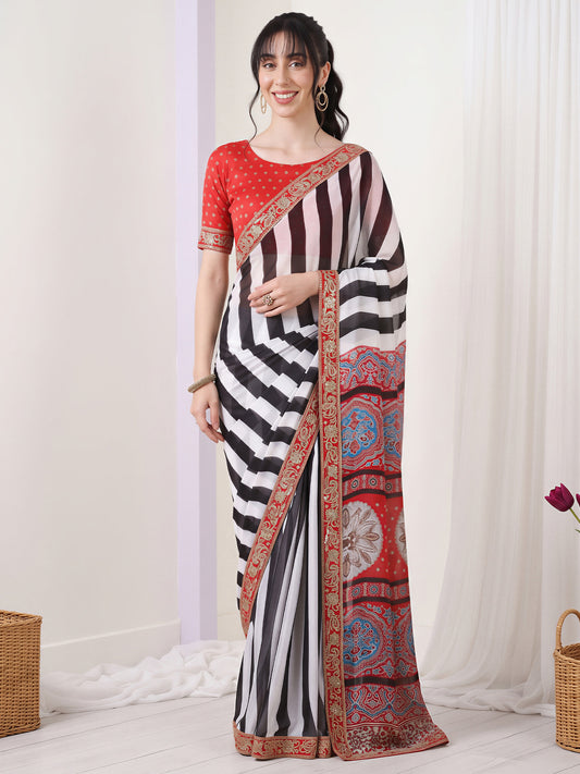 Woman wearing white pure georgette saree with zebra-stripe design and red blouse