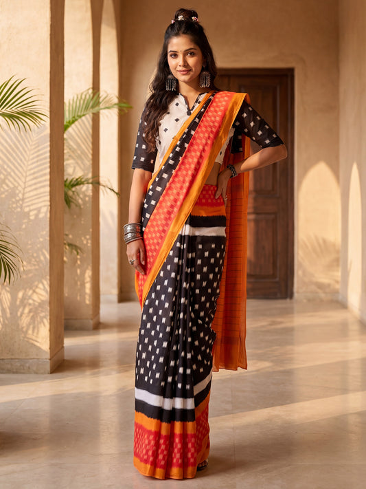 Woman wearing black cotton blend saree with geometric pattern design and white blouse