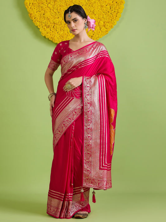 Woman wearing pink silk blend saree with zari butta (metallic motif) work and pink blouse