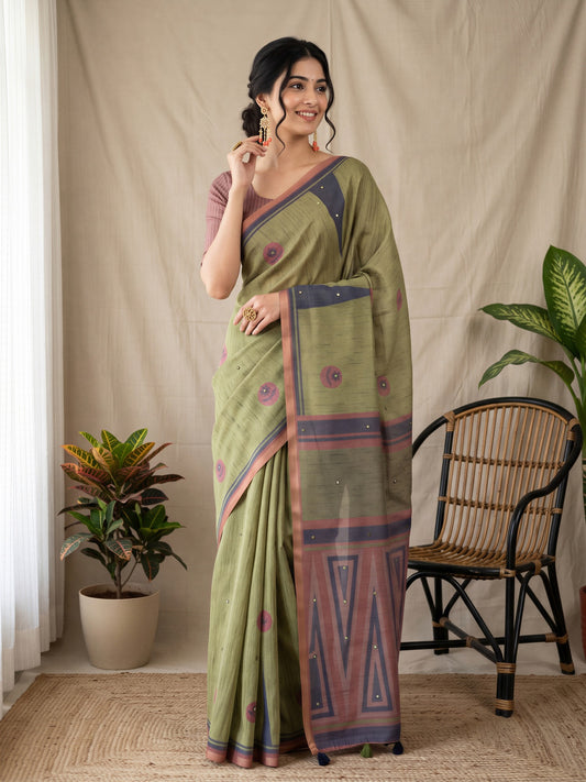 Woman wearing olive linen blend saree with geometric pattern design and light brown blouse
