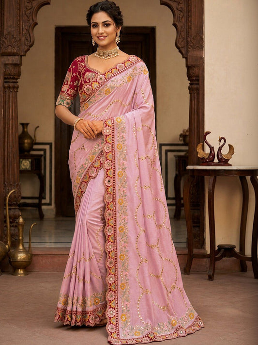 Woman wearing pink pure georgette saree with all-over floral design and pink blouse
