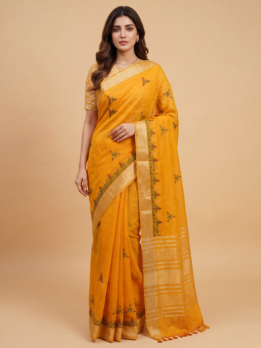 Woman wearing mustard cotton linen saree with embroidered motif work and mustard blouse
