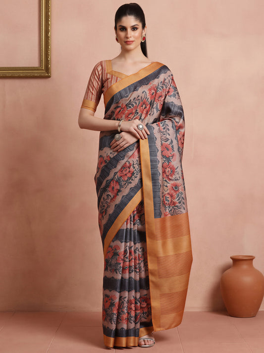 Woman wearing rust cotton blend saree with all-over floral design and rust blouse