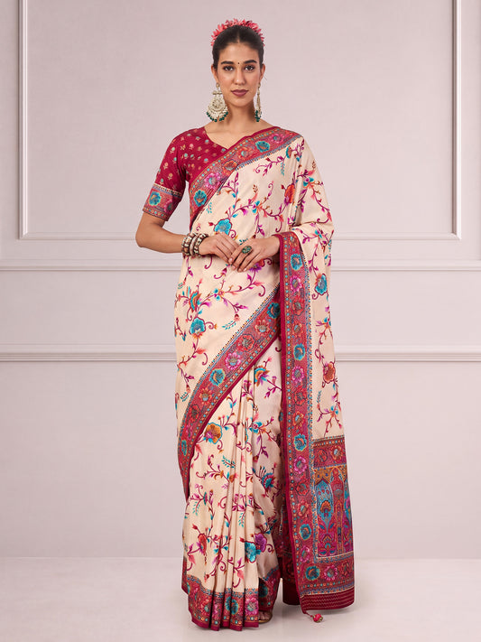 Woman wearing cream viscose saree with metallic foil print work and maroon blouse