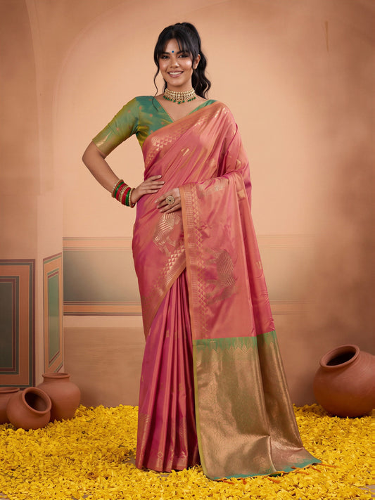 Woman wearing pink silk saree with animal-print design and light green blouse