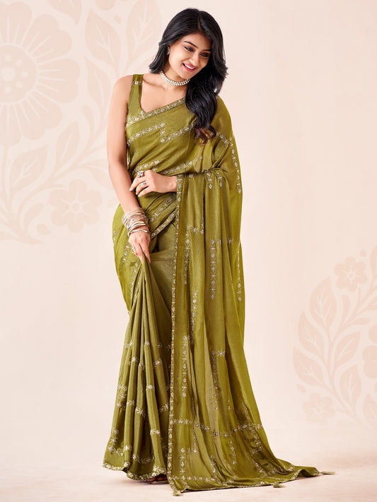 Woman wearing olive chiffon saree with ornamented surface design and olive blouse