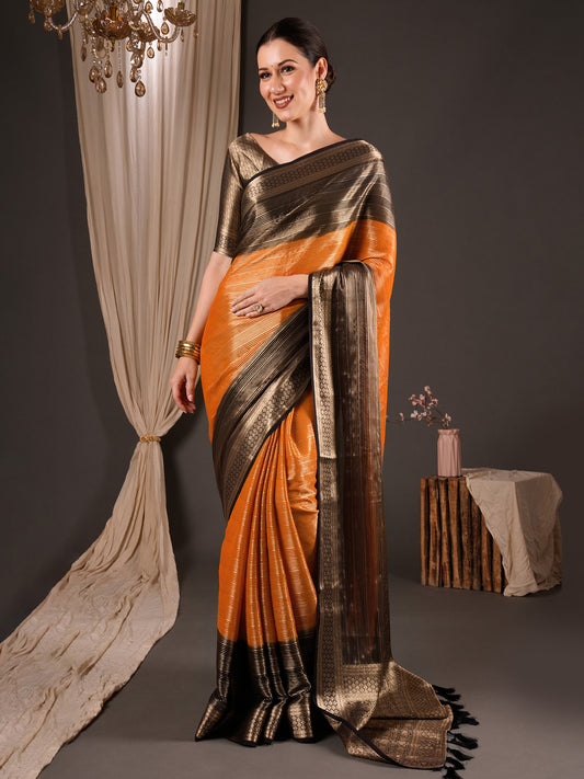 Woman wearing orange viscose silk saree with striped pattern design and green blouse