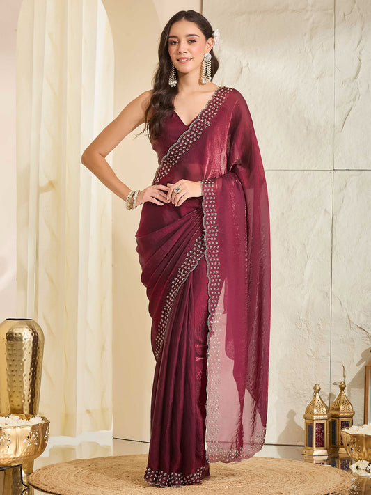 Woman wearing wine satin saree with clean solid-tone finish and wine blouse