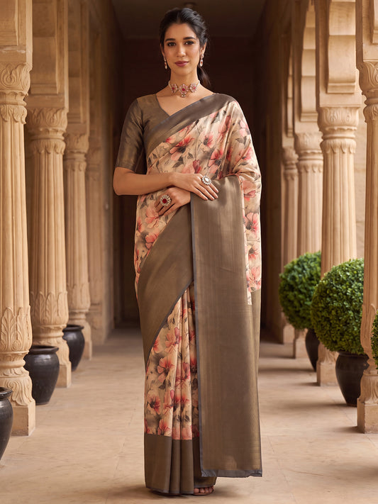 Woman wearing beige silk blend saree with all-over floral design and charcoal grey blouse