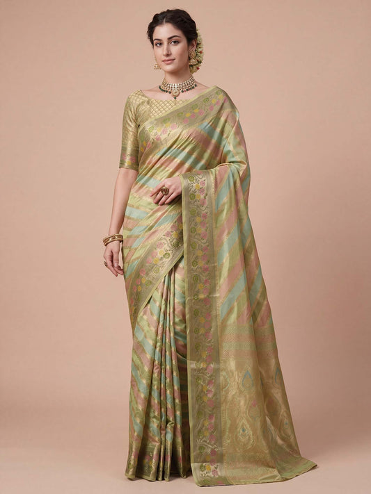 Woman wearing light green organza saree with striped pattern design and light green blouse