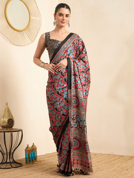 Woman wearing black pure crepe saree with ajrak block-print motif work and black blouse