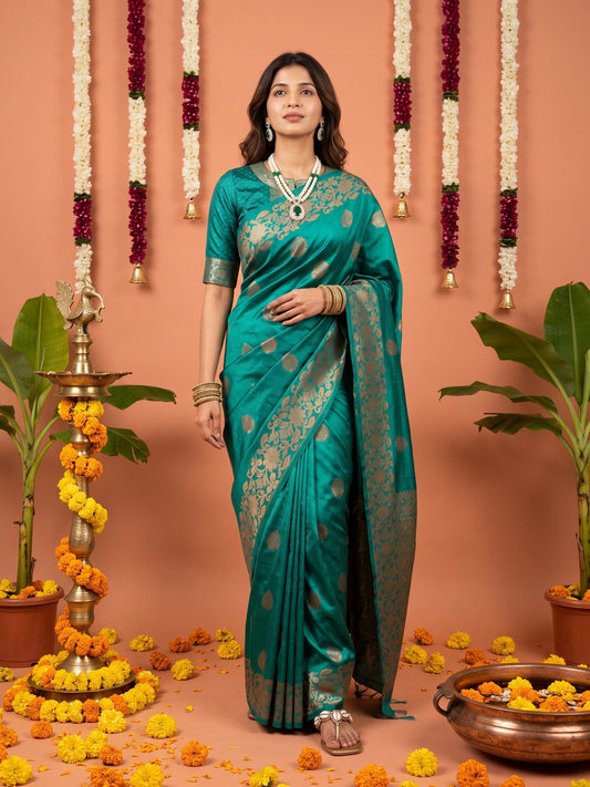 Woman wearing teal blue silk blend saree with zari butta (metallic motif) work and teal blue blouse