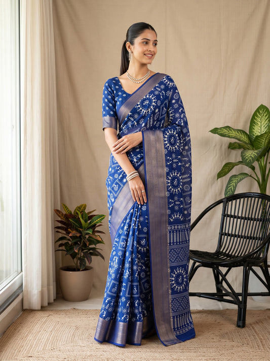 Woman wearing blue georgette saree with warli folk-art figures and blue blouse